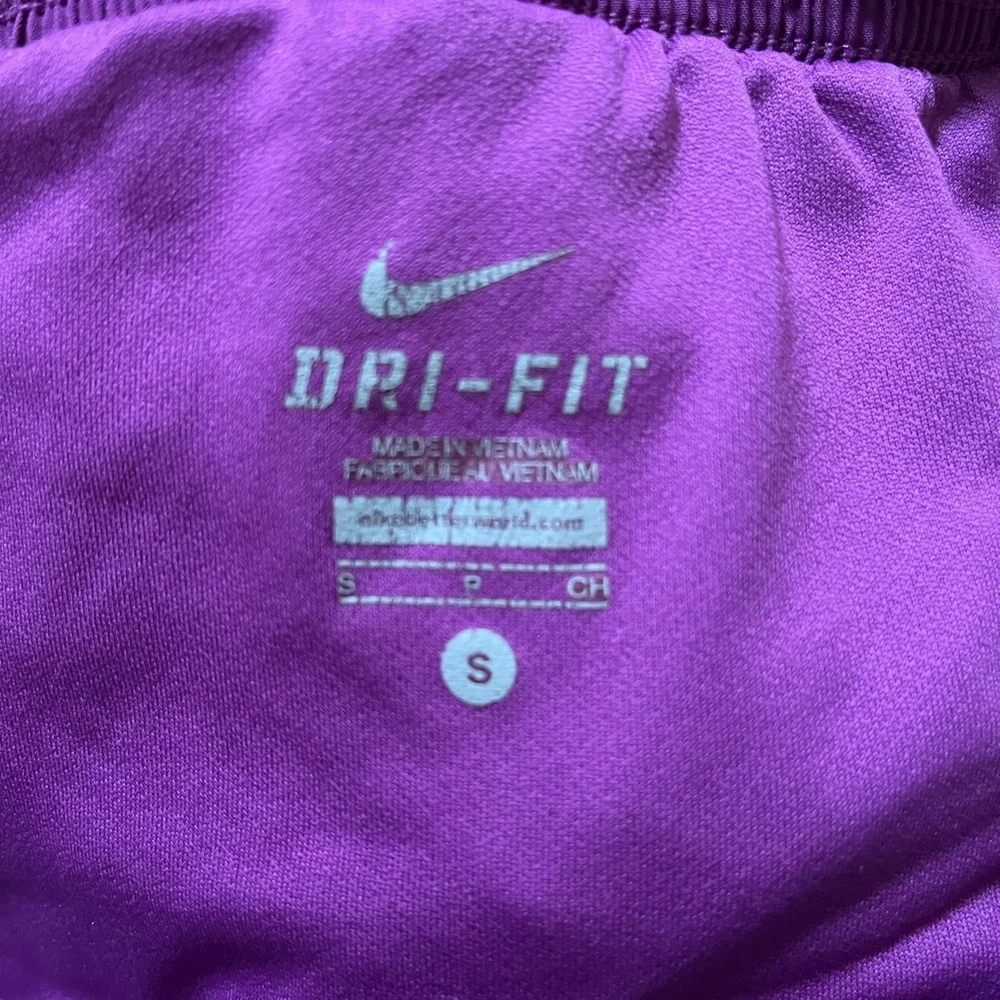 Women’s purple Dri-Fit Nike running shorts with animal print